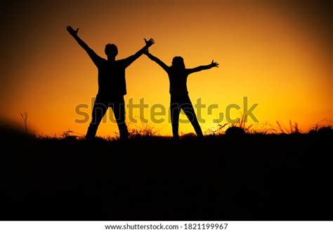 Happy Cheering Couple Enjoying Sunset Holidays Stock Photo 1821199967