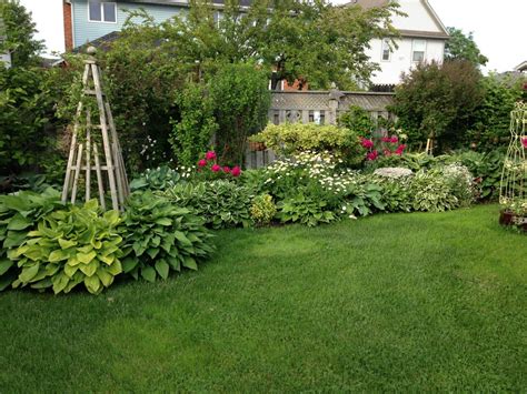 How to grow herbs, fruits, and vegetables in a small space. Diana's garden in Ontario - FineGardening