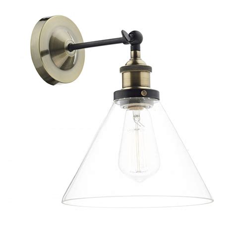 Incorporate bold colors into your interior design with art glass wall sconces from destination lighting. Antique Brass Wall Light with Clear Glass Shade in Vintage Styling