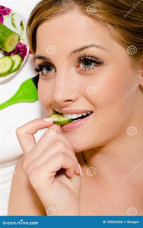 Spa Treatment By Eating Cucumber Young Sensual Beautiful Veggie Girl Attractive Woman With Blue