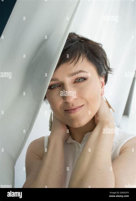 Close Up Tender Portrait Of A Female Face Short Haired Brunette Stock