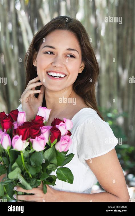 Happy Young Woman Holding Bunch Of Colorful Roses Stock Photo Alamy