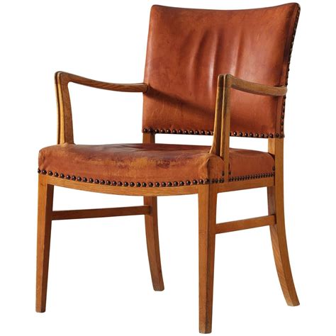 Find the perfect balance of high style and plush comfort with the viewbank faux leather armchair. Danish Armchair in Oak and Cognac Leather | Danish ...