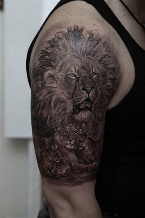 Delightful Tattoo Of A Lion Lioness And Two Cubs On Half