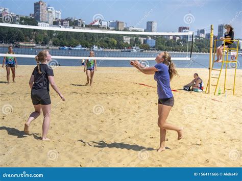 cute girls play beach volleyball friends watch the game editorial photo image of game