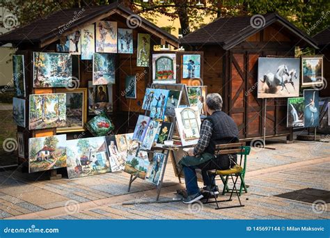 Street Artists Sell Paintings To Tourists On A Street Market Editorial