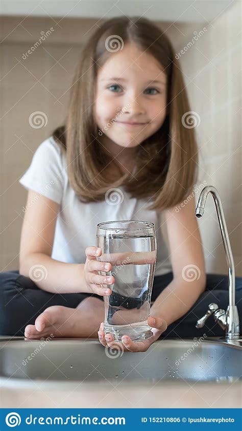 Little Child Is Drinking Clean Water At Home Close Up Caucasian Cute