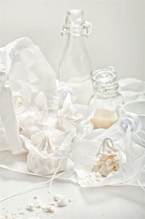 High Key Still Life With Meringues Crumbs Glass Jars And Cup W Stock