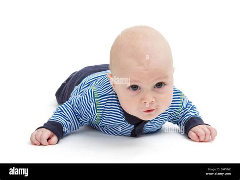 Attentive Baby Laying On Ground Isolated On White Background Stock