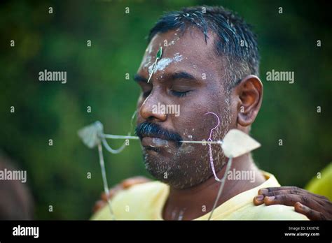 a man performing a hindu ritual for the thaipusam festival george town penang malaysia stock