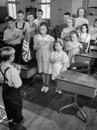 This opens in a new window. Children Reciting the Pledge of Allegiance as a Boy Holds ...