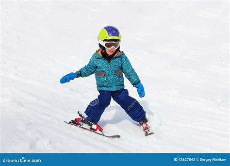 Smiling Boy In Ski Mask Learns Skiing Stock Photo Image Of Practice