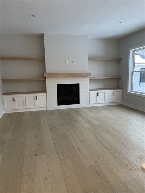 Cozy Living Room With Fireplace And White Cabinets