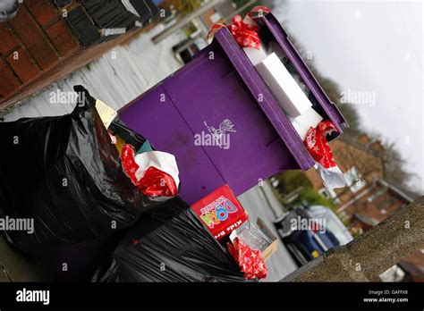 A Rubbish Bin In Liverpool Overflows With Wrapping Paper And Packaging