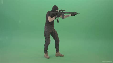 Amatory man with gun shooting in green screen studio - 4K Video Footage ...