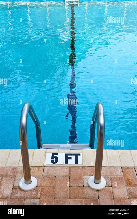 Swimming Pool Ladder And Water Depth Marker Stock Photo Alamy
