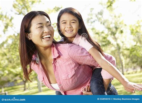 Portrait Asian Mother And Daughter Playing In Park Stock Photo Image