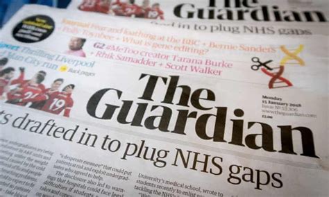 The Guardian Newspaper Is Laying On Top Of Each Other