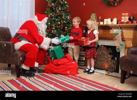 Santa Claus Gives Young Boy Hi Res Stock Photography And Images Alamy