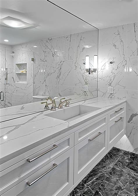 Floating White Vanity Has Quartz Countertop With Integrated Sink And