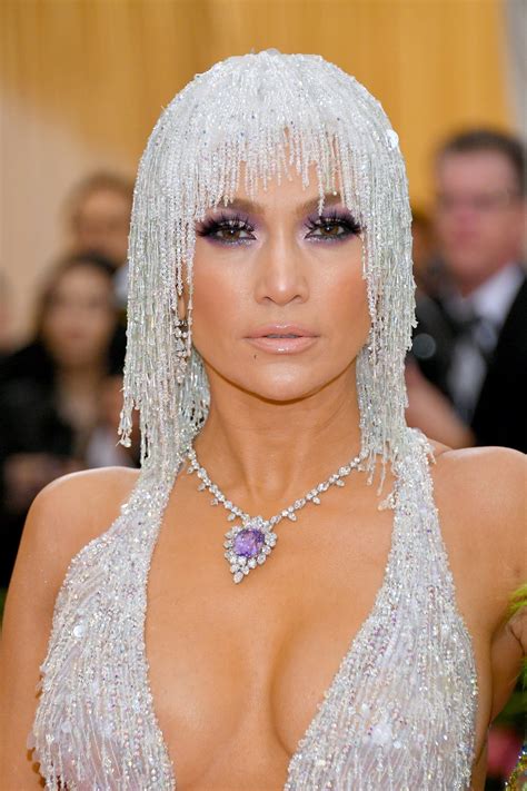 Don't be fooled by the rocks that she got. Jennifer Lopez's Met Gala 2019 Versace Gown | InStyle.com