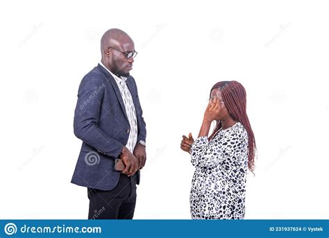 Adult Businessman And Businesswoman Looking At Each Other Stock Photo