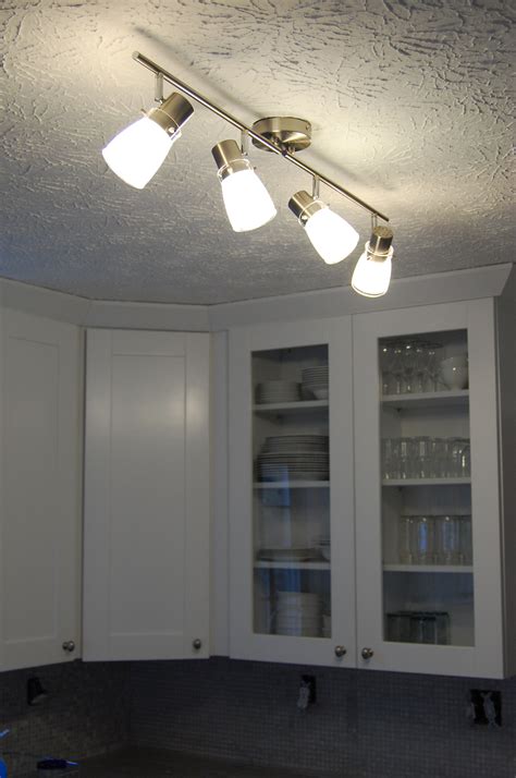 Track lighting is an effective, versatile and stylish way to offer ample lighting. Lights, Camera, Overstock! | DesignOCD