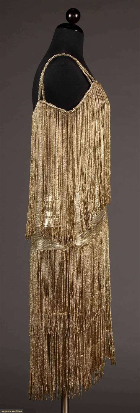 From the beaded floral details to the lamé fabric's liquid feel, this graceful gold dress exudes decadence. GOLD LAME FRINGED DRESS, 1920s | Fashion, Clothing and textile, Flapper dress