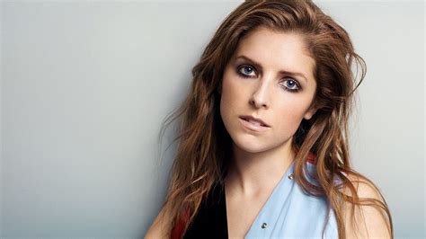 Anna Kendrick Is Wearing Blue Black And Red Dress With Gray Background