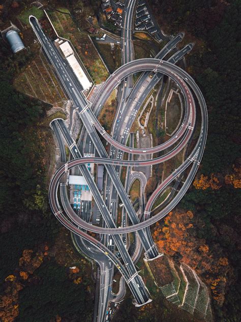 A Highway Interchange In Between Mountain Tunnels Drone Photos