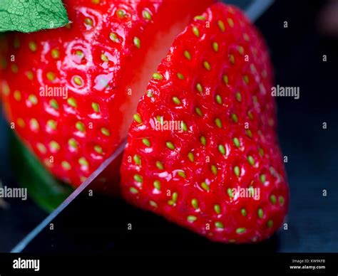 A Macro Photograph Of A Fresh Sliced Strawberry Stock Photo Alamy