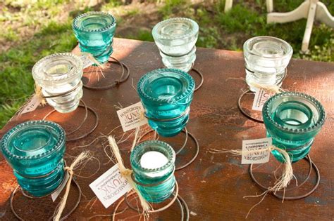 Old Mattress Springs With Glass Insulators To Make Candle Holders