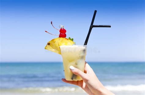 Tropical Pina Colada Drink With Pineapple In A Hand Of The Woman On A