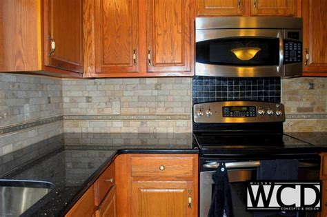 The backsplash is an affordable builder grade ceramic tile. Adams Kitchen Counters & Backsplash