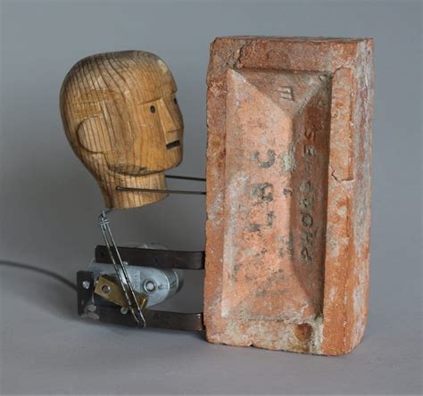 Brick By Nik Ramage A Motorised Wooden Head Bangs Itself Against A