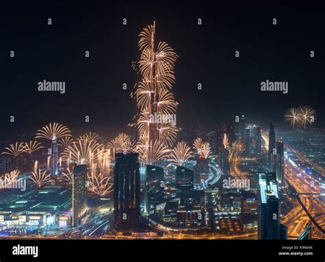 Cityscape Of Dubai United Arab Emirates At Night With Fireworks And