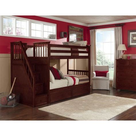 A Bedroom With Red Walls And Wooden Bunk Beds In The Corner Along With