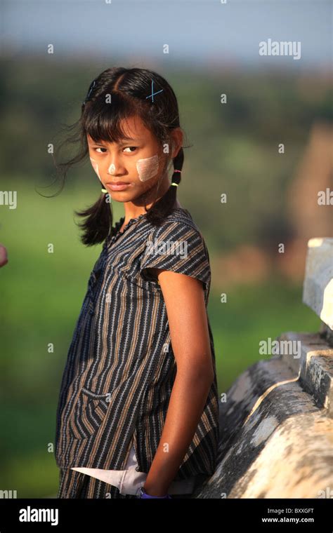 A Young Girl Wearing Myanmar Makeup On The Shwesandaw Pagoda Or Sunset