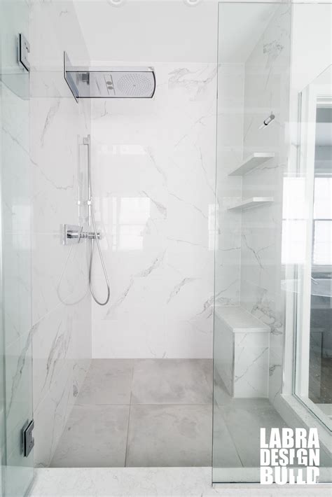 Each piece is made to order. Labra Design+Build | White Marble Tile Shower Bathroom Remodel