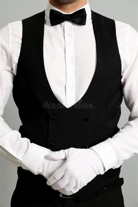 Butler In Elegant Uniform On Grey Background Closeup Stock Image