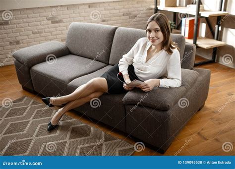 Nice Young Businesswoman Sit On Sofa And Pose On Camera Model Smile