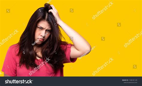 Scowling Girl Scratching Her Head Who Stock Photo Edit Now 1748181125