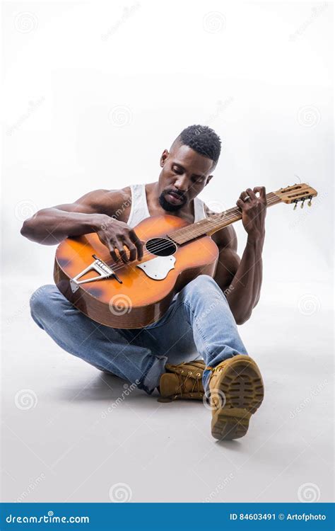 Muscular Black Man Playing Guitar Stock Image Image Of Indoor White