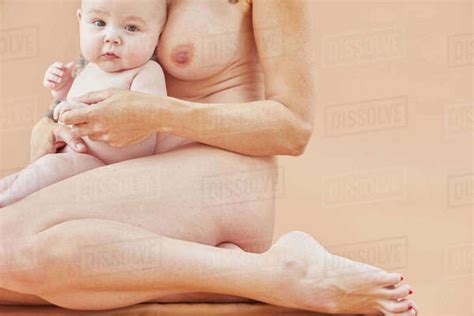 Naked Mother Bonding With Naked Baby On Lap Naked Mother Bonding With