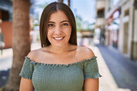 Young Hispanic Girl Smiling Happy Standing At The City Stock Image