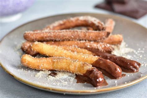 Churros With Chocolate Sauce Churros Con Chocolate Everyday Delicious