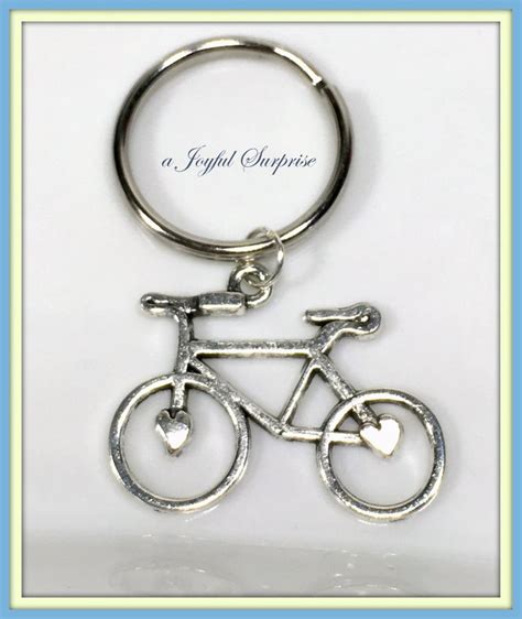 A Metal Key Chain With A Bicycle On It