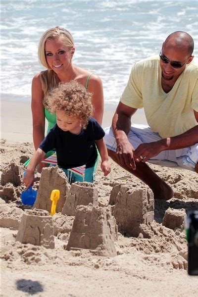 kendra wilkinson hank baskett and their son hank baskett iv build sandcastles at the beach in