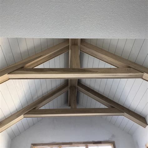 By definition, vaulted ceilings are arched. Cathedral with 7" MDF shiplap and truss style beams. Large ...