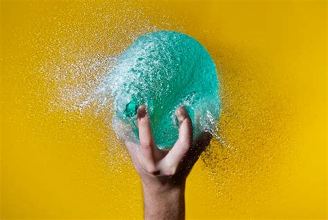 High Speed Photography Of Popping Water Balloons Design Swan